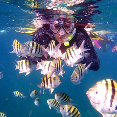 girl snorkeling under water