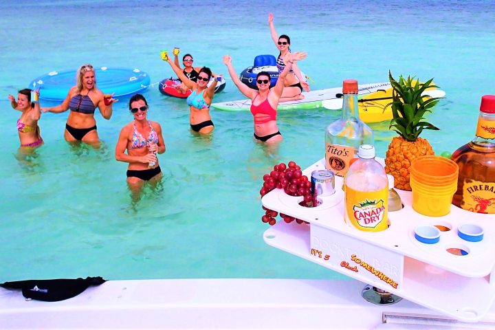 Group of people standing in shallow water